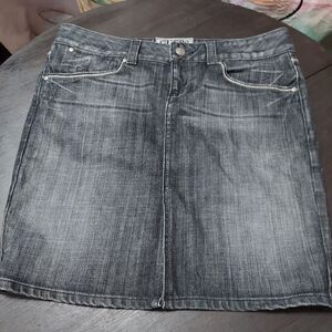 Guess denim skirt size 31 length 18 5". Embroidered logo and embellished rear po